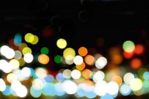 Abstract colorful bokeh and blurred reflection lighting on black background photo