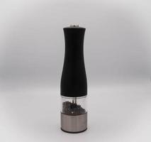black electric pepper grinder, in an Italian kitchen during a typical Italian lunch photo