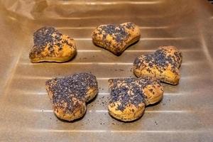 baked rolls in a heart shape on a baking tray photo