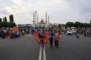 Tegal, December 2022. The atmosphere of the Tegal city square in the afternoon with many tourists visiting. photo