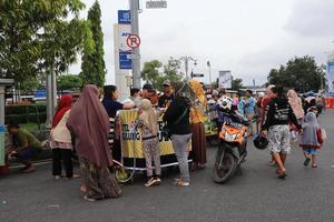 Tegal, December 2022. The atmosphere of the Tegal city square in the afternoon with many tourists visiting. photo