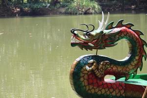 Semarang,December 2022.Dragon boat to go around the lake in the zoo to see pelicans photo