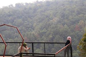 Kudus, December 2022. The atmosphere of visitors is enjoying the incandescent park tour with relaxing, beautiful and cool views photo