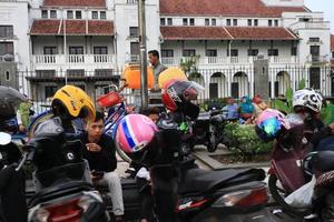 Tegal, December 2022. Photo of the motorbike parking lot in the Tegal city square which is crowded and full of motorcycle visitors.