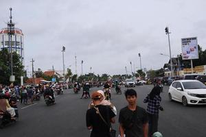 Tegal, December 2022. The atmosphere of the Tegal city square in the afternoon with many tourists visiting. photo