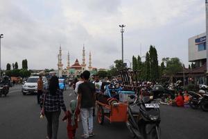 Tegal, December 2022. The atmosphere of the Tegal city square in the afternoon with many tourists visiting. photo