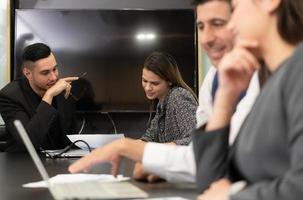 New business people in the conference room are exchanging information with each other along with rehearsing important information photo