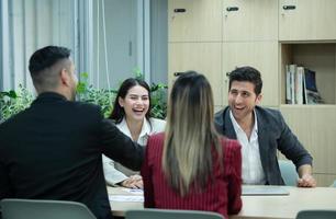 A group of young entrepreneurs. Meeting to exchange opinions and review information to prepare for investing in new stocks related photo