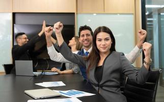 New business people in the conference room are exchanging information with each other along with rehearsing important information photo