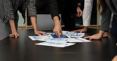 New business people in the conference room are exchanging information with each other along with rehearsing important information photo