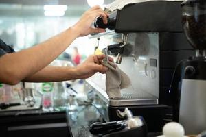 Coffee expert barista Making hot Americano for customers photo