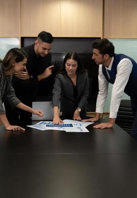 New business people in the conference room are exchanging information with each other along with rehearsing important information