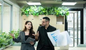 Boss and secretary with the stressful mood of a failed job and angry that the job failed again photo