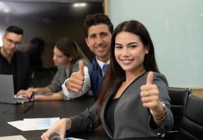 New business people in the conference room are exchanging information with each other along with rehearsing important information photo