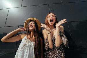 Two attractive young women fooling around in fresh air. photo