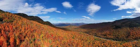 Peak fall foliage in Keene, New York by Cascade Lake. photo