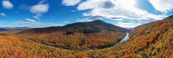 Peak fall foliage in Keene, New York by Cascade Lake. photo