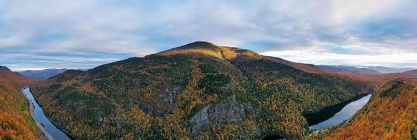 Peak fall foliage in Keene, New York by Cascade Lake. photo