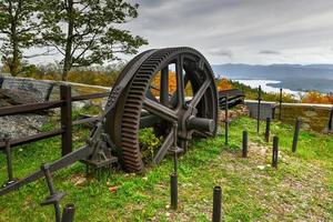 The old cable railway gear equipment on the summit of Prospect Mountain in Lake George, New York on a summer sunny day. photo