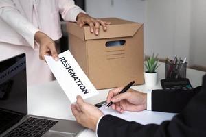 Employees have personal storage boxes on their side. And send a resignation letter to the manager. Changing jobs, relocating positions photo