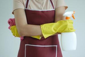Housekeeper holds equipment for cleaning photo