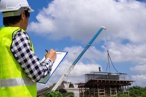 The inspectors or engineers are checking the work of the contractor team to build a bridge over the road. photo