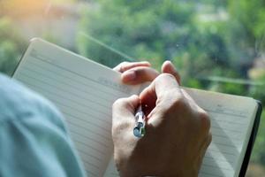 The hands of men are written using white hands. photo