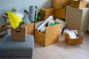 Box for personal belongings and furniture. Moving boxes in a new house photo