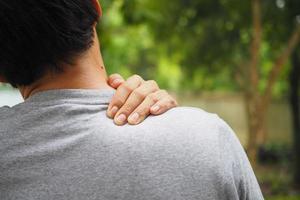 Neck and shoulder pain and muscle injury of man photo