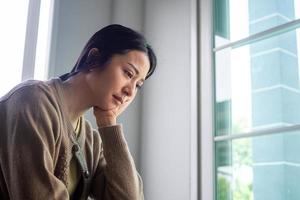 A sad and disappointed asian woman photo