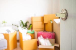 The door that is open inside the room has personal belongings waiting to be moved. Moving into a new home photo