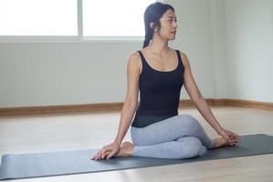 Women are doing seated twist exercises for health and a firmer body. yoga concept photo