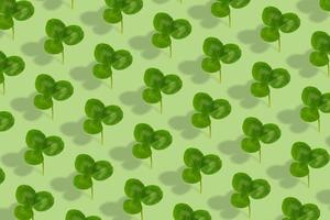 Clover leaf pattern on colored background. Abstract background for St. Patrick's Day photo