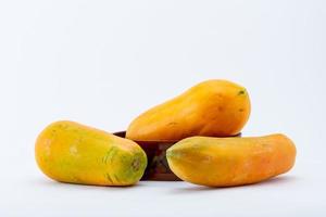 Tropical fruit. Papaya on the white background. photo