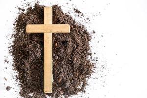 Christian cross or crucifix drawing in ash, dust or sand as symbol of religion, sacrifice, redemption, Jesus Christ, ash wednesday, lent, Good Friday, Easter with Church is devoted to fasting photo