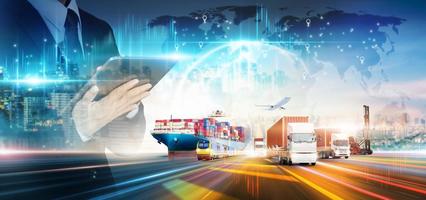 Smart logistics networks distribution of businessman using tablet and delivery transport technology concept, Container cargo freight ship and truck at industrial port, Global business import export