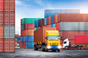 Transport of container truck at shipping depot dock yard background with stack colorful containers box, Logistics import export goods of freight carrier and global transportation industry concept photo