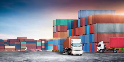 Transport of container truck at shipping depot dock yard background with stack colorful containers box, Logistics import export goods of freight carrier and global transportation industry concept photo