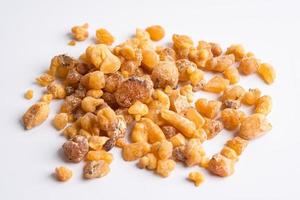 Frankincense or olibanum aromatic resin isolated on white background used in incense and perfumes. photo