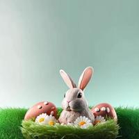 bunny and decorative eggs on green grass and flowers for easter holiday celebration background greeting card photo