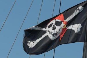 waving pirate flag jolly roger photo