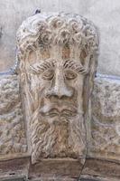 medieval bas relief head statue photo