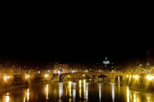 Rome Tevere river night view with Saint Peter church photo