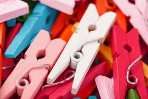 Colorful Wooden clothespins close-up as texture and background. photo