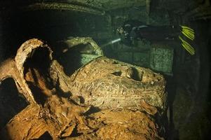 Old Car inside II world war ship wreck hold photo