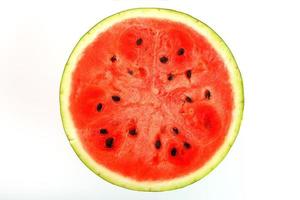 Half of juicy, red watermelon on a white background, texture of juicy pulp and mesmeses of ripe watermelon photo