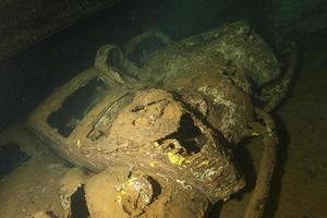 Old Car inside II world war ship wreck hold photo