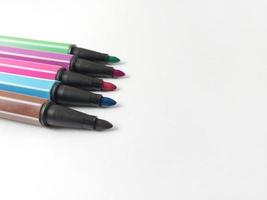 colorful markers isolated on white background photo