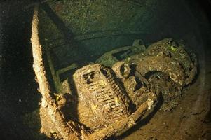 Old Car inside II world war ship wreck hold photo