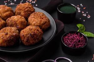 Delicious fresh meat or vegetable cutlets with spices and herbs photo